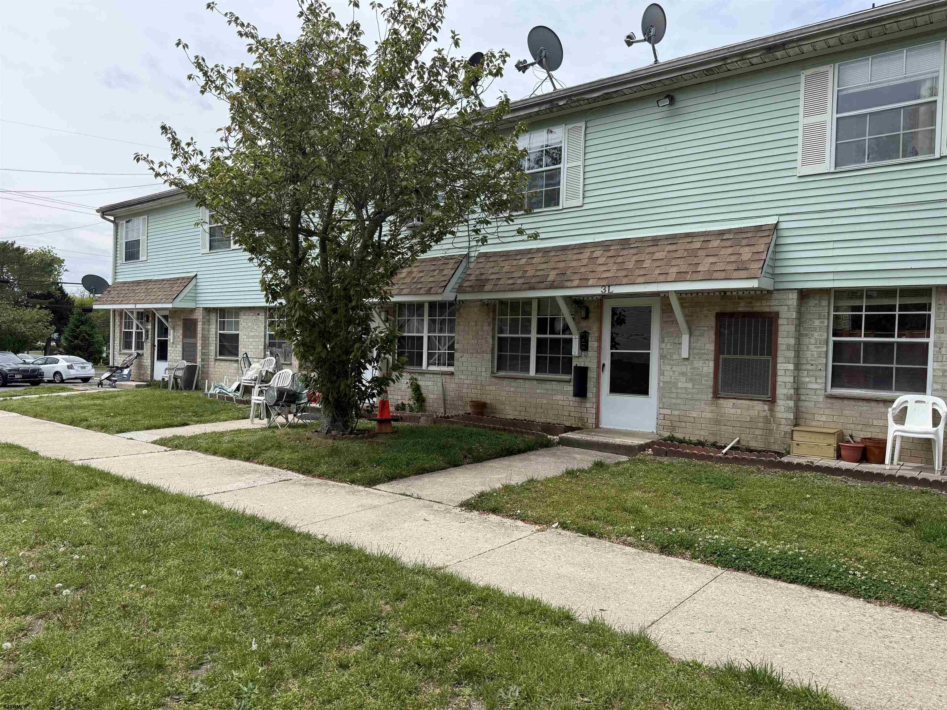 720 South New Road, Unit 3L Absecon, NJ 08201 - Photo 2 of 25 a front view of a house with a yard