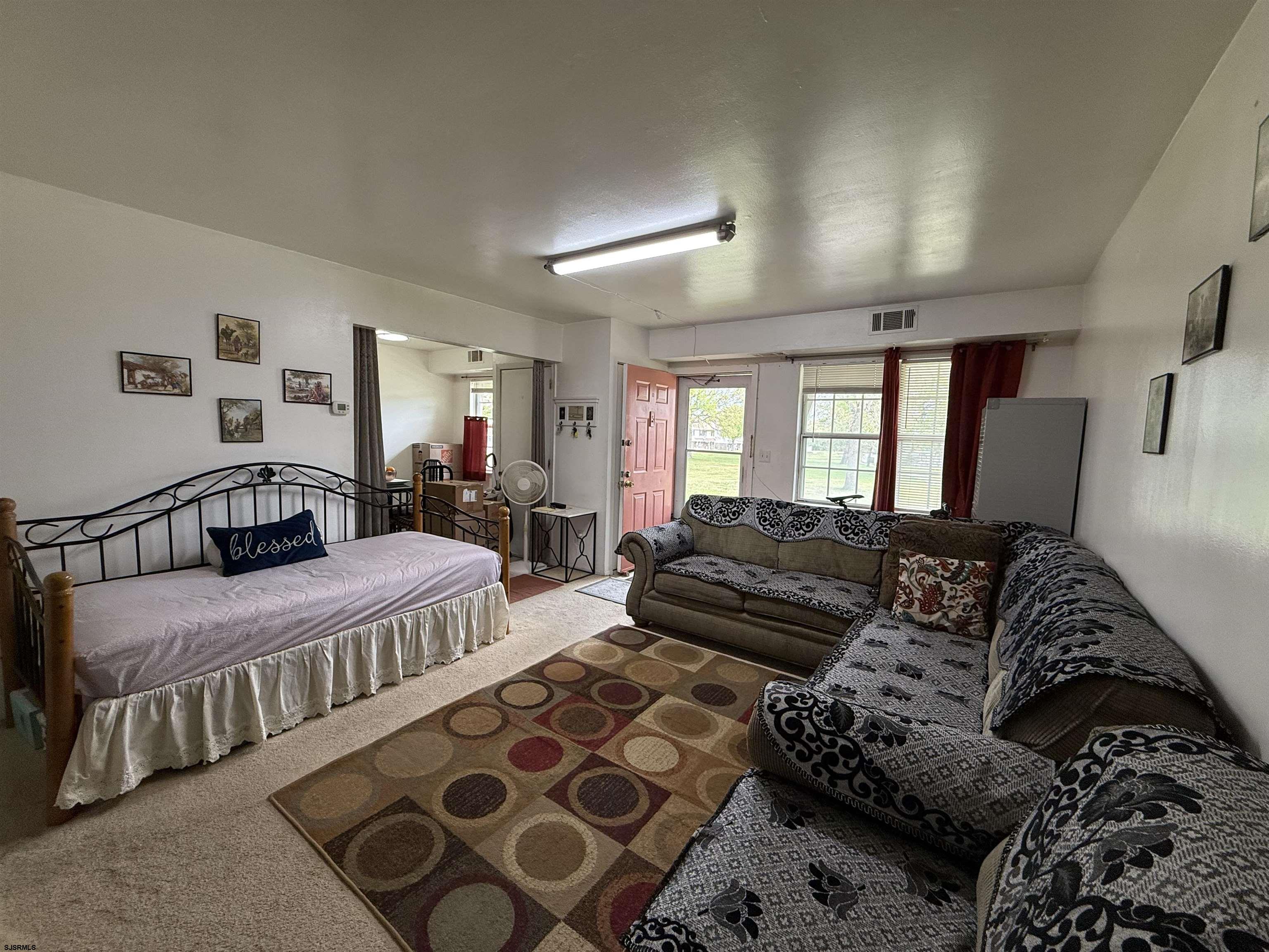 720 South New Road, Unit 3L Absecon, NJ 08201 - Photo 3 of 25 a bedroom with double bed and a couch