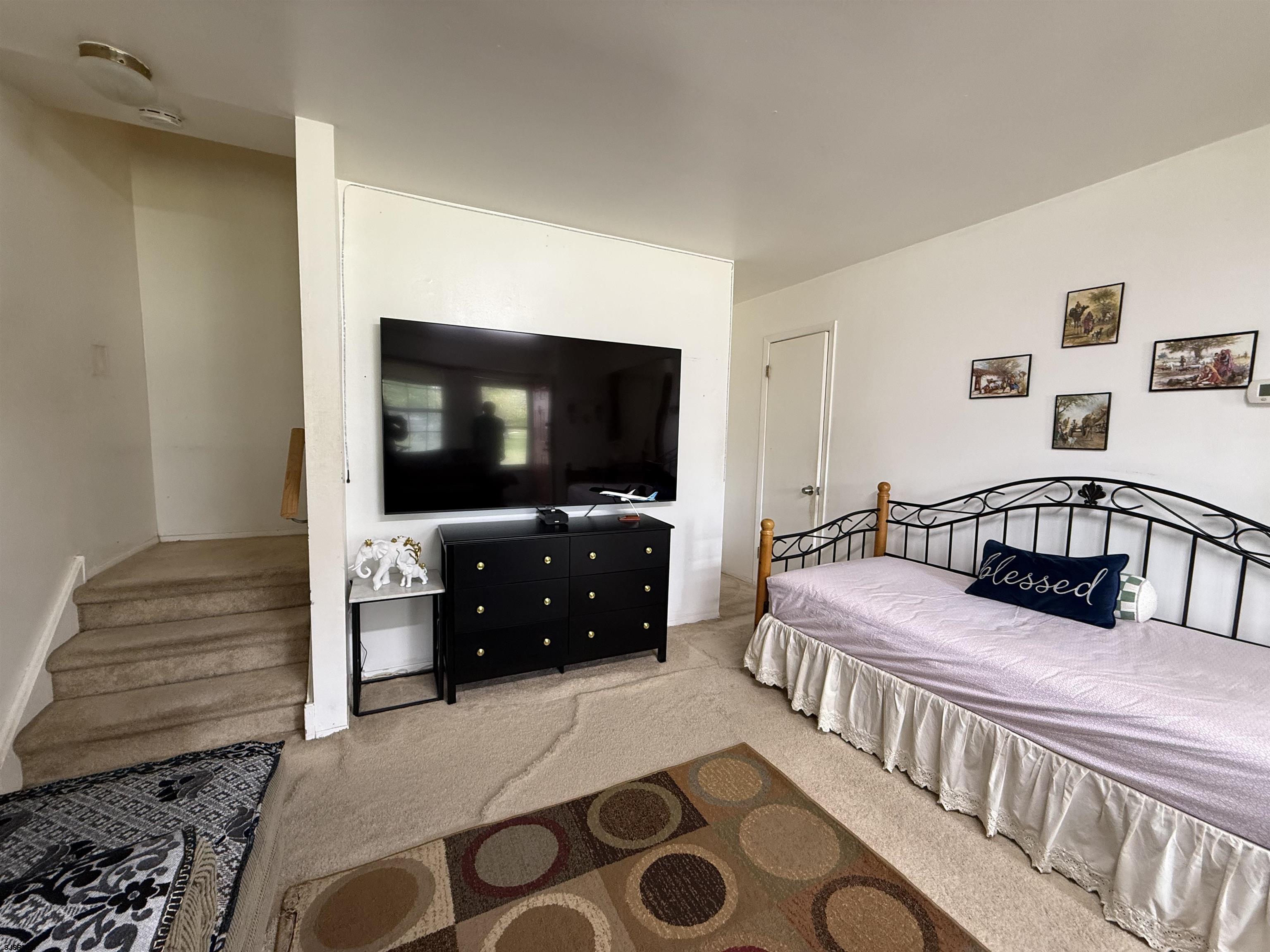 720 South New Road, Unit 3L Absecon, NJ 08201 - Photo 5 of 25 a bedroom with a bed and a flat screen tv