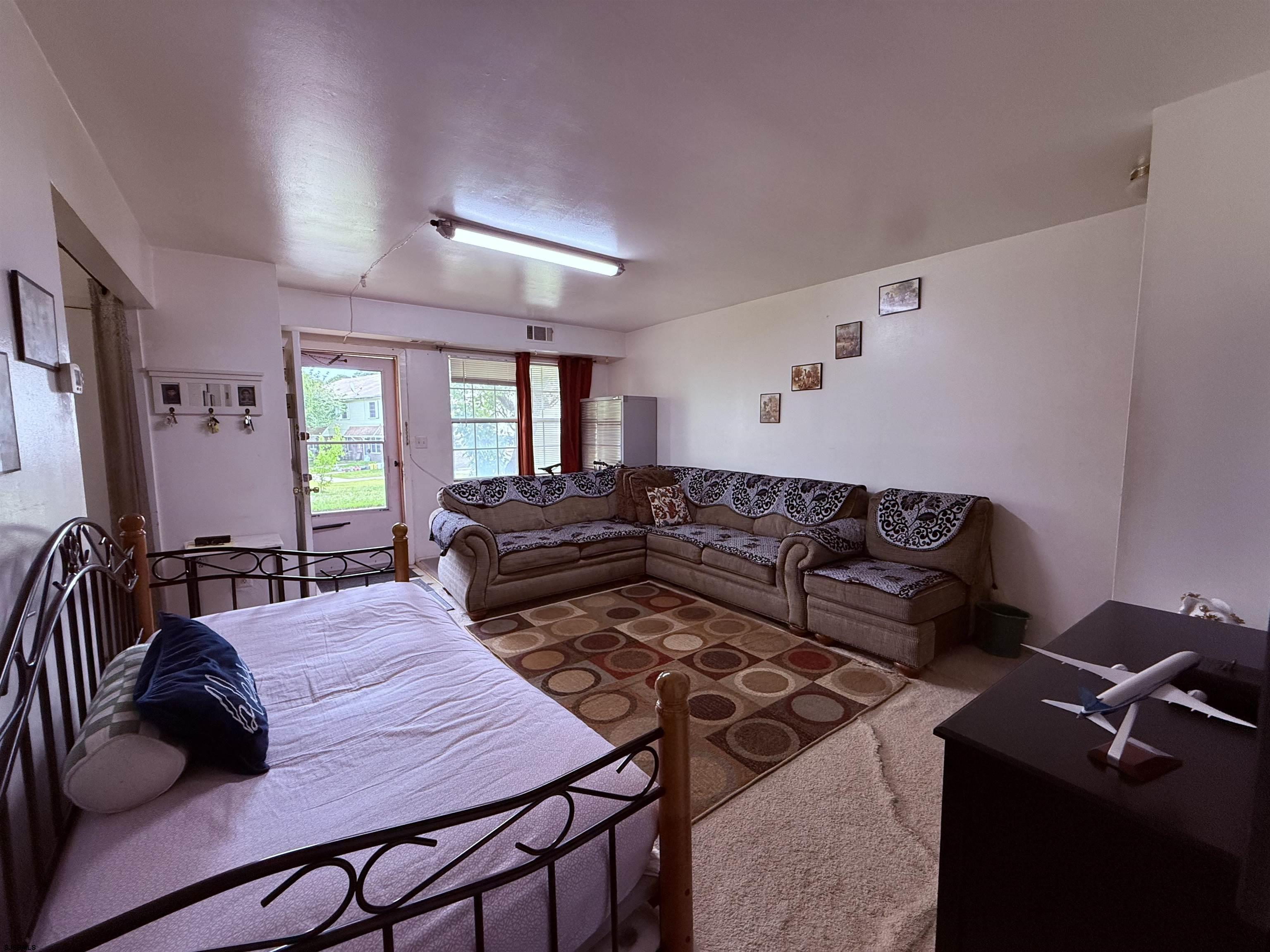 720 South New Road, Unit 3L Absecon, NJ 08201 - Photo 7 of 25 a living room with furniture and wooden floor