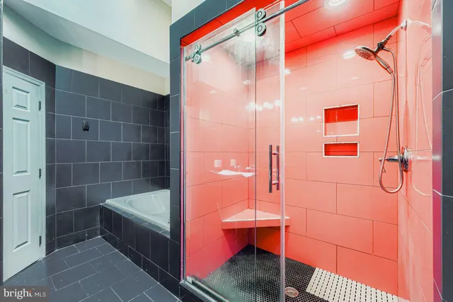 a bathroom with a shower and a sink