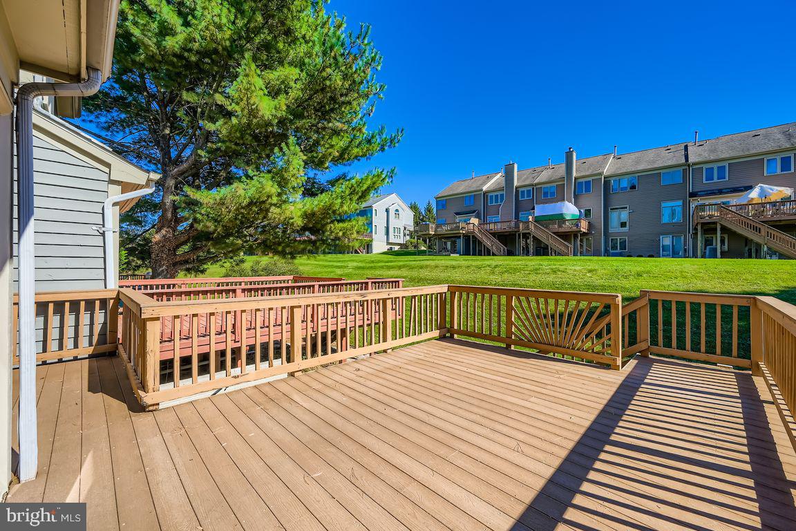 21 Stridesham Court Baltimore, MD 21209 - Photo 20 of 22 a view of a wooden deck and a yard