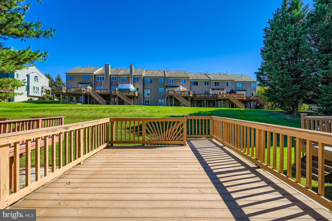 21 Stridesham Court Baltimore, MD 21209 - Photo 21 of 22 a view of a deck with wooden floor and city view