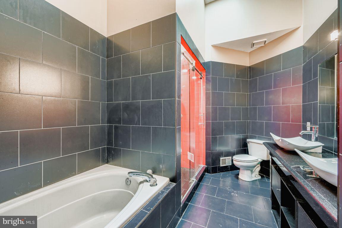 21 Stridesham Court Baltimore, MD 21209 - Photo 10 of 22 a bathroom with a sink and toilet