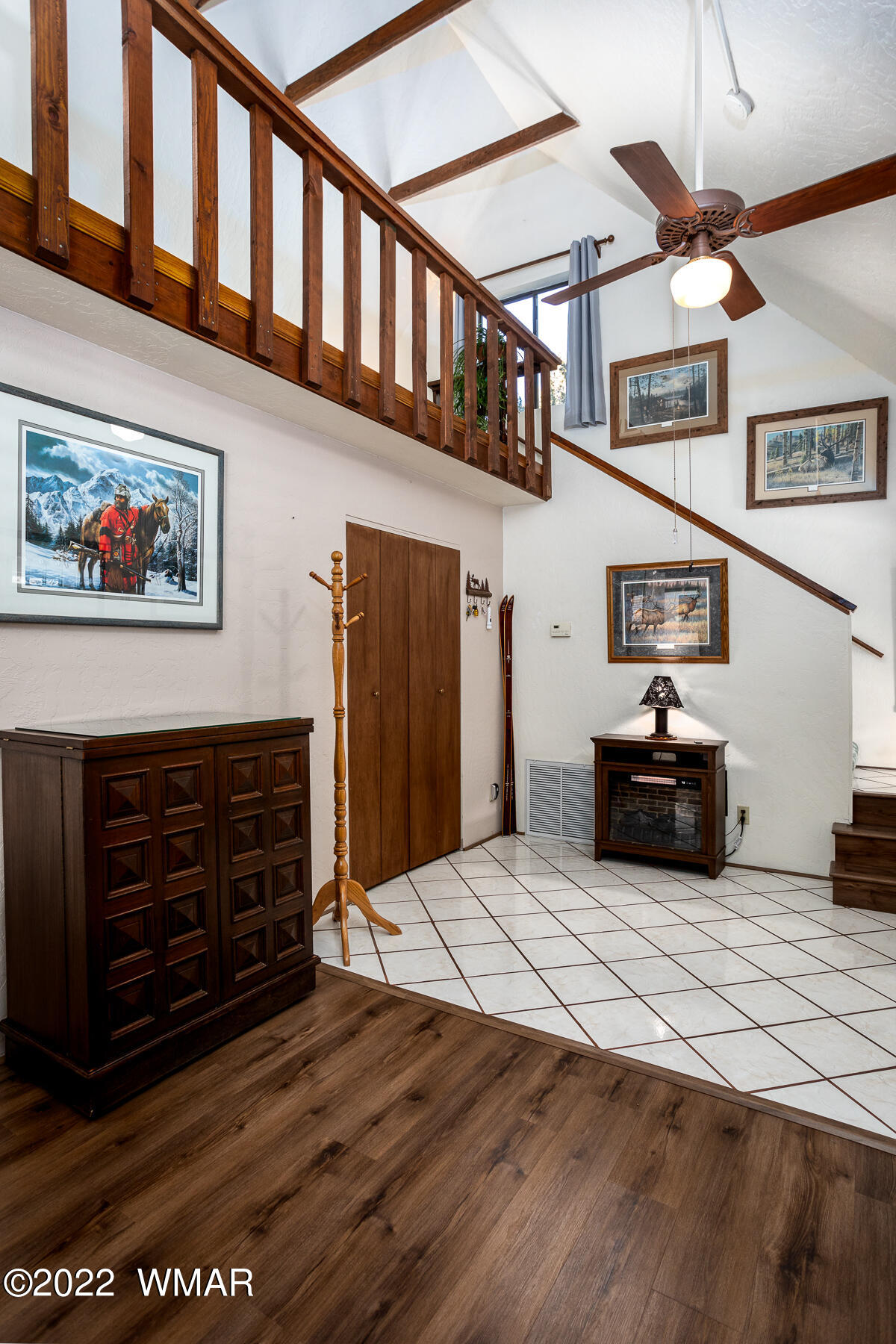 2840 Lodgepole Road Overgaard, AZ 85933 - Photo 17 of 30 a view of a hallway with wooden floor and staircase