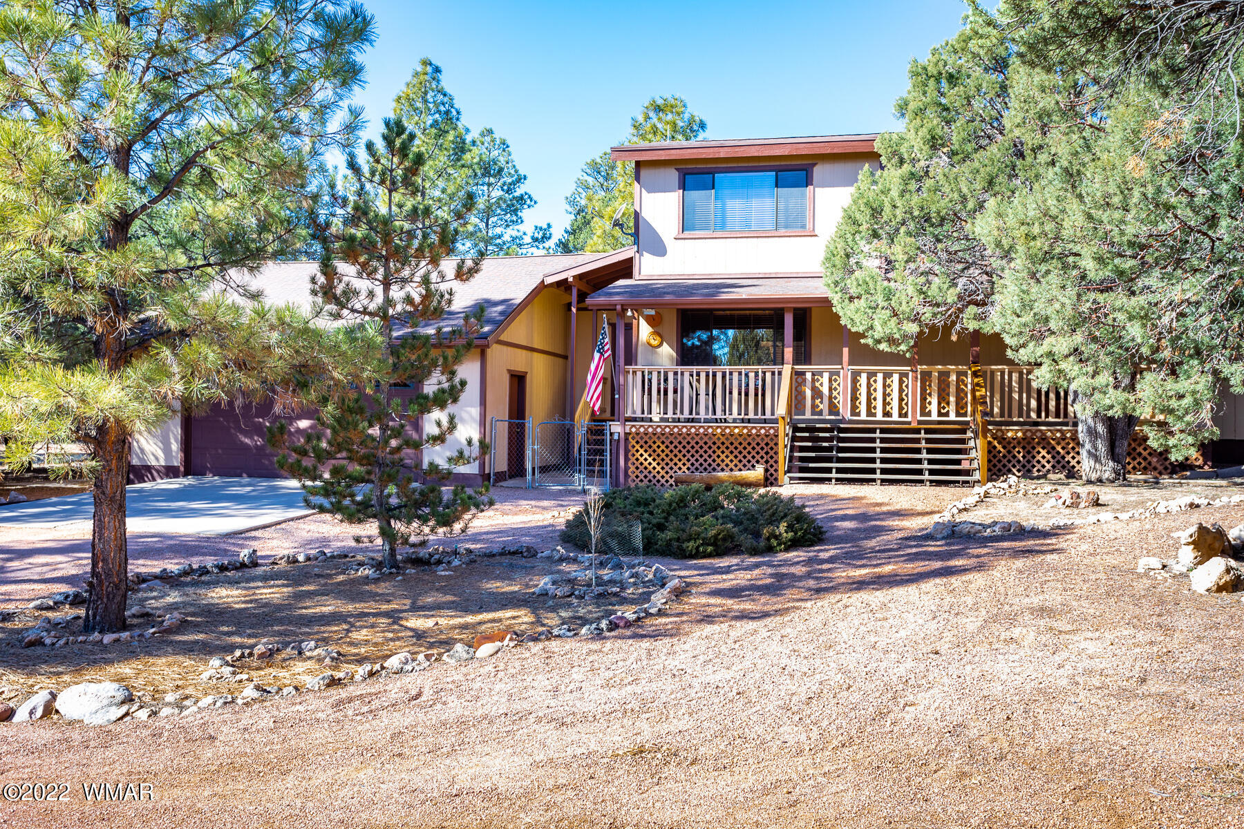 2840 Lodgepole Road Overgaard, AZ 85933 - Photo 3 of 30 a front view of a house with a yard
