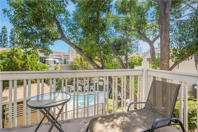 a view of a balcony with furniture
