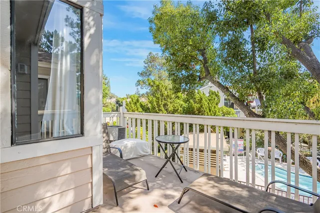 a view of a balcony with furniture