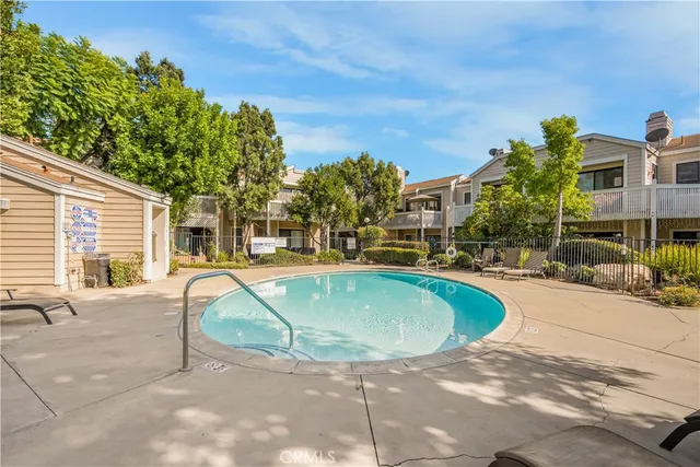 a view of a swimming pool with a patio