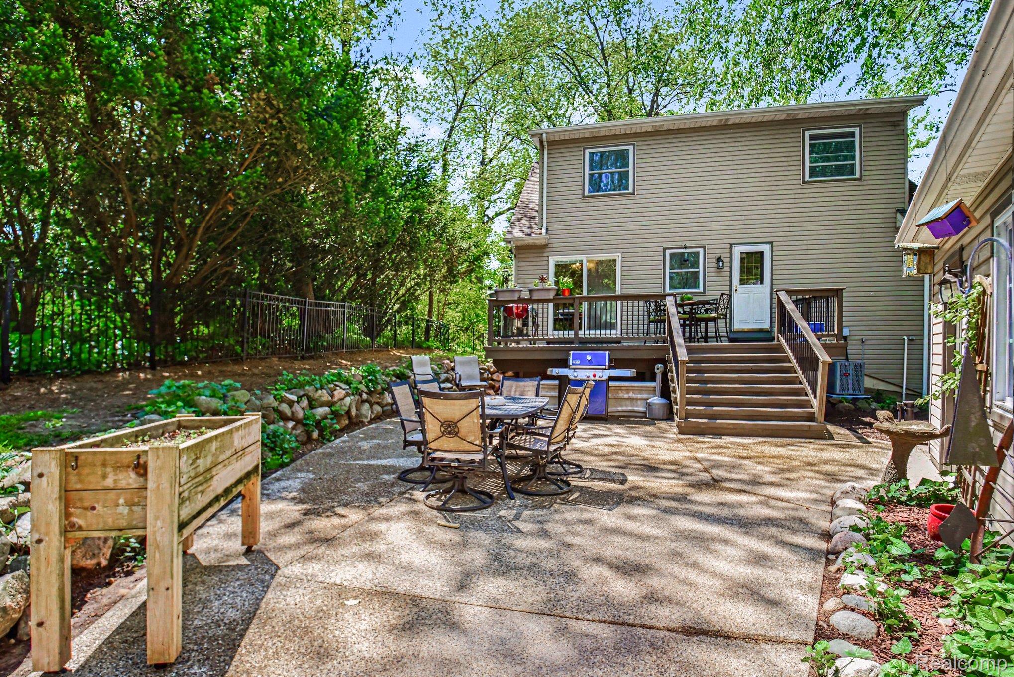 9790 Norman Road Clarkston, MI 48348 - Photo 23 of 25 Rear exterior with patio & deck