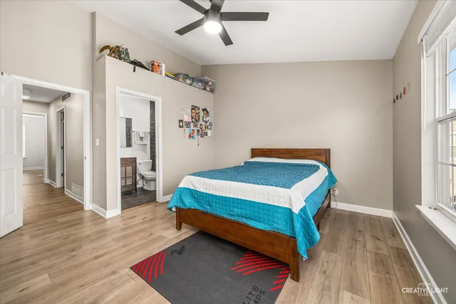 a bedroom with a bed and a table