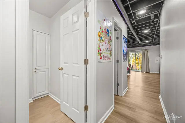 a view of hallway with stairs and furniture