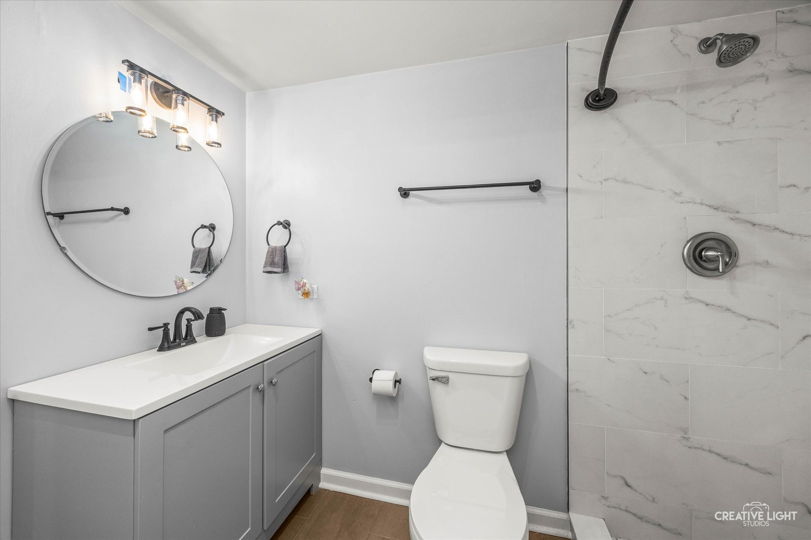 1426 Grandview Court Algonquin, IL 60102 - Photo 19 of 28 a bathroom with a toilet sink and mirror