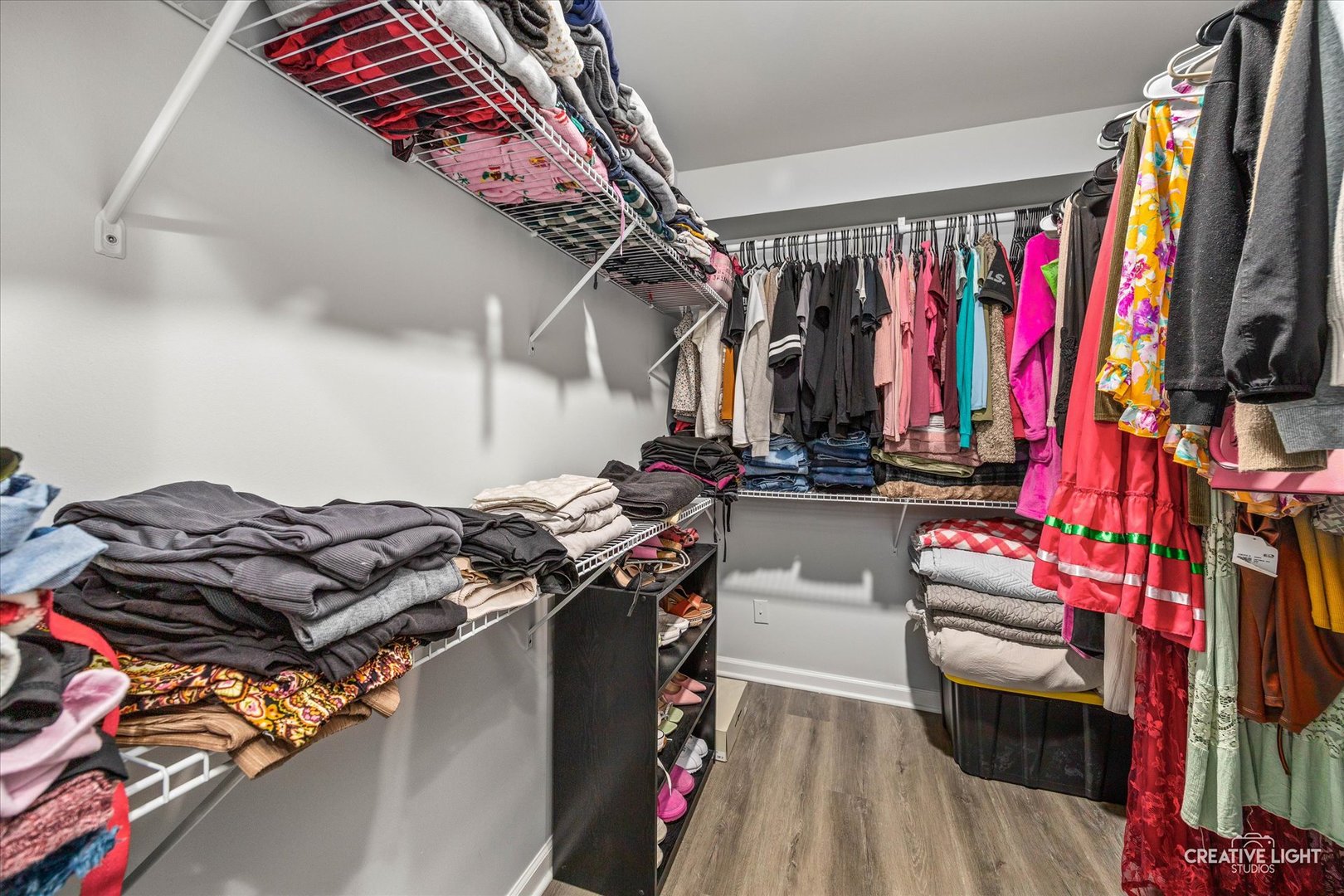 1426 Grandview Court Algonquin, IL 60102 - Photo 20 of 28 a view of walk in closet with clothes and shoes