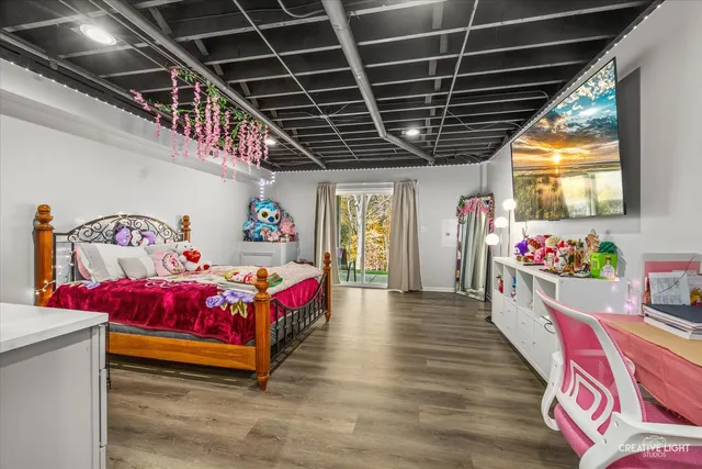 a bedroom with furniture and a chandelier