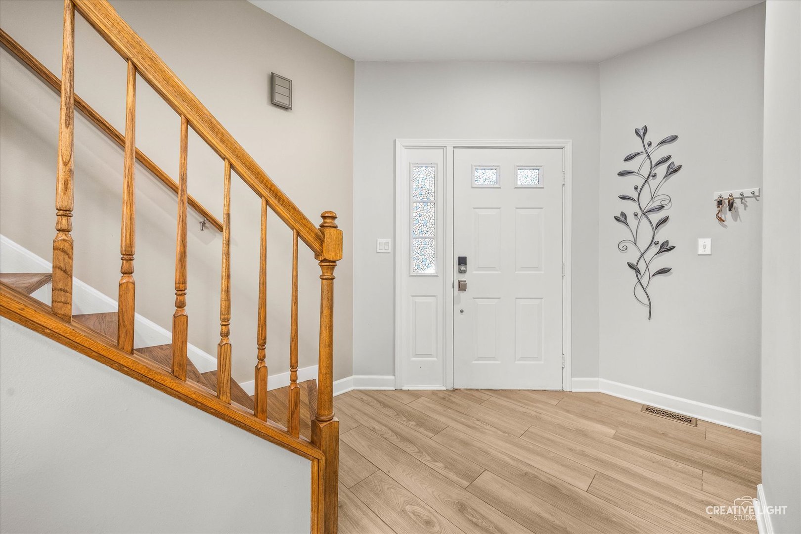 1426 Grandview Court Algonquin, IL 60102 - Photo 3 of 28 a view of an entryway with wooden floor