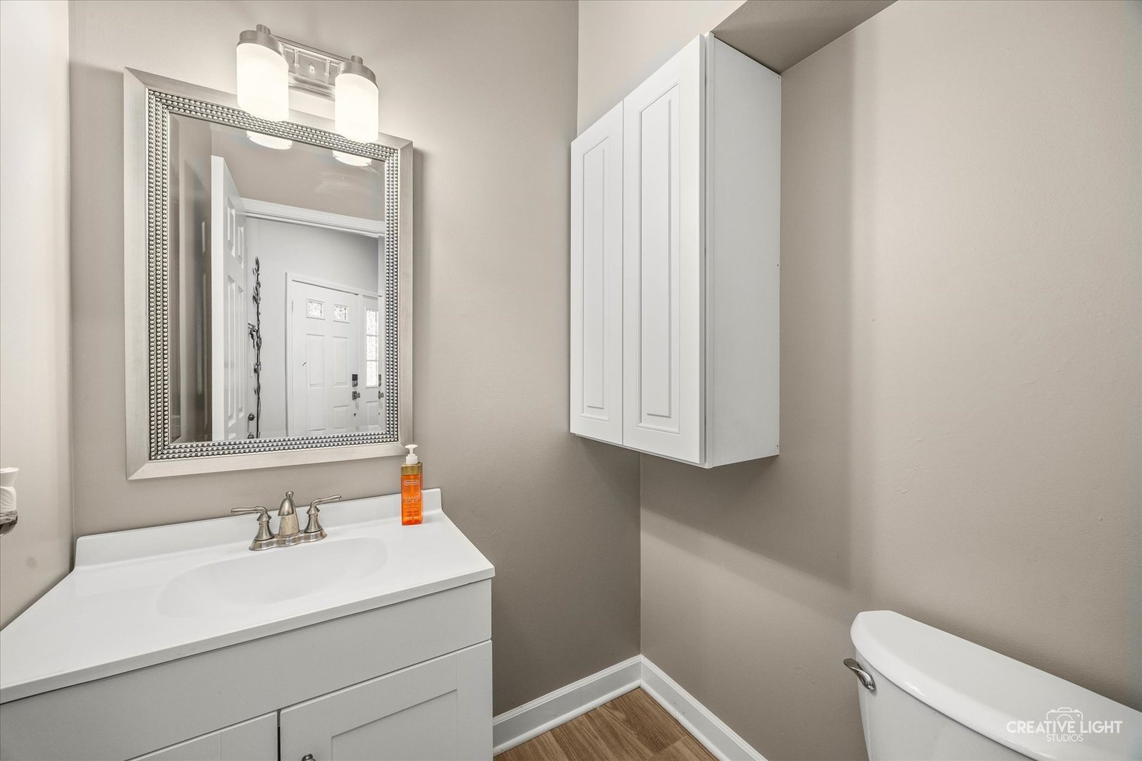 1426 Grandview Court Algonquin, IL 60102 - Photo 4 of 28 a bathroom with a sink and a toilet