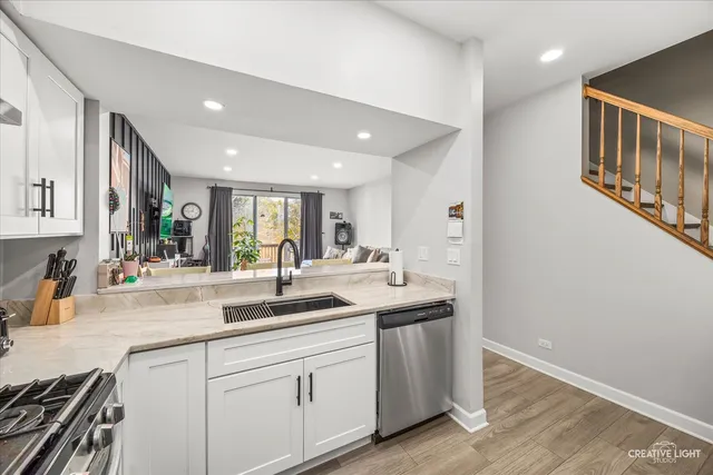 a kitchen with sink and cabinets