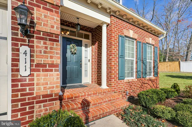 a view of a brick building with a yard