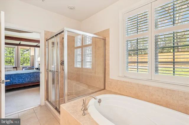 a bathroom with a tub and shower