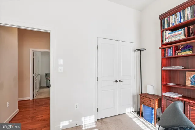 a view of room with cabinet and wooden floor