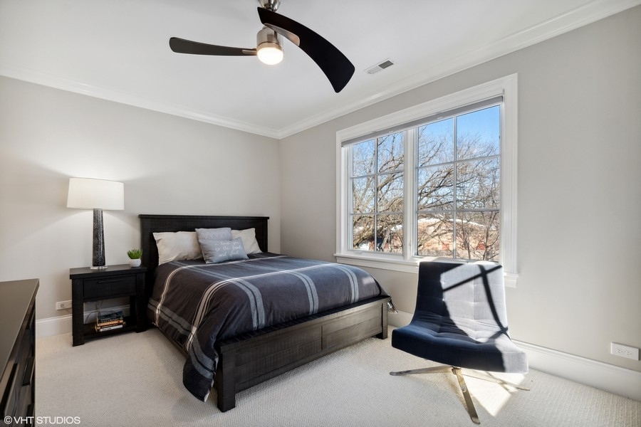 544 Sterling Road Kenilworth, IL 60043 - Photo 13 of 30 a spacious bedroom with a bed and large windows