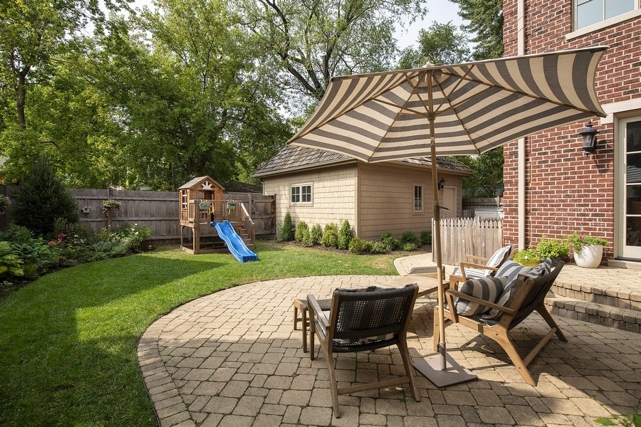 544 Sterling Road Kenilworth, IL 60043 - Photo 24 of 30 a view of a house with backyard sitting area and garden