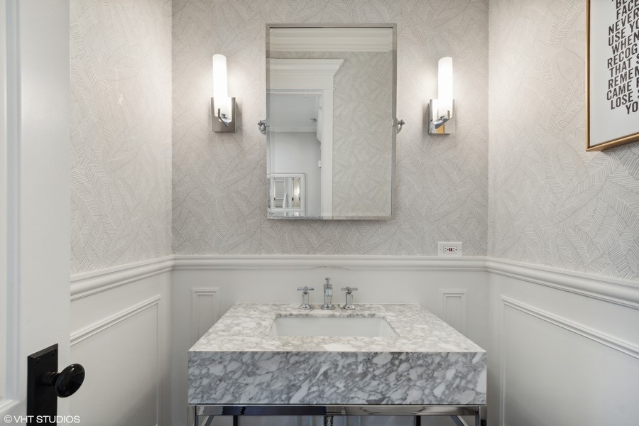 544 Sterling Road Kenilworth, IL 60043 - Photo 9 of 30 a bathroom with a granite countertop sink and a mirror