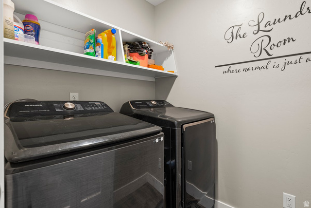 463 South Trejo Ridge Road Grantsville, UT 84029 - Photo 10 of 22 Dedicated laundry area featuring built-in shelving, light gray wall paint, and electrical outlets