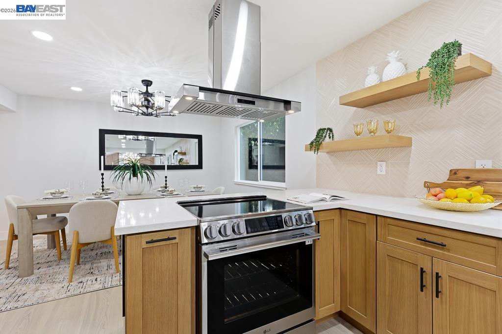 74 Hazelnut Court San Ramon, CA 94583 - Photo 18 of 60 a kitchen with a stove and cabinets