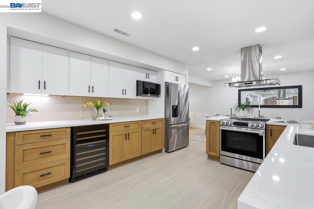 74 Hazelnut Court San Ramon, CA 94583 - Photo 20 of 60 a kitchen with granite countertop a sink stainless steel appliances and cabinets