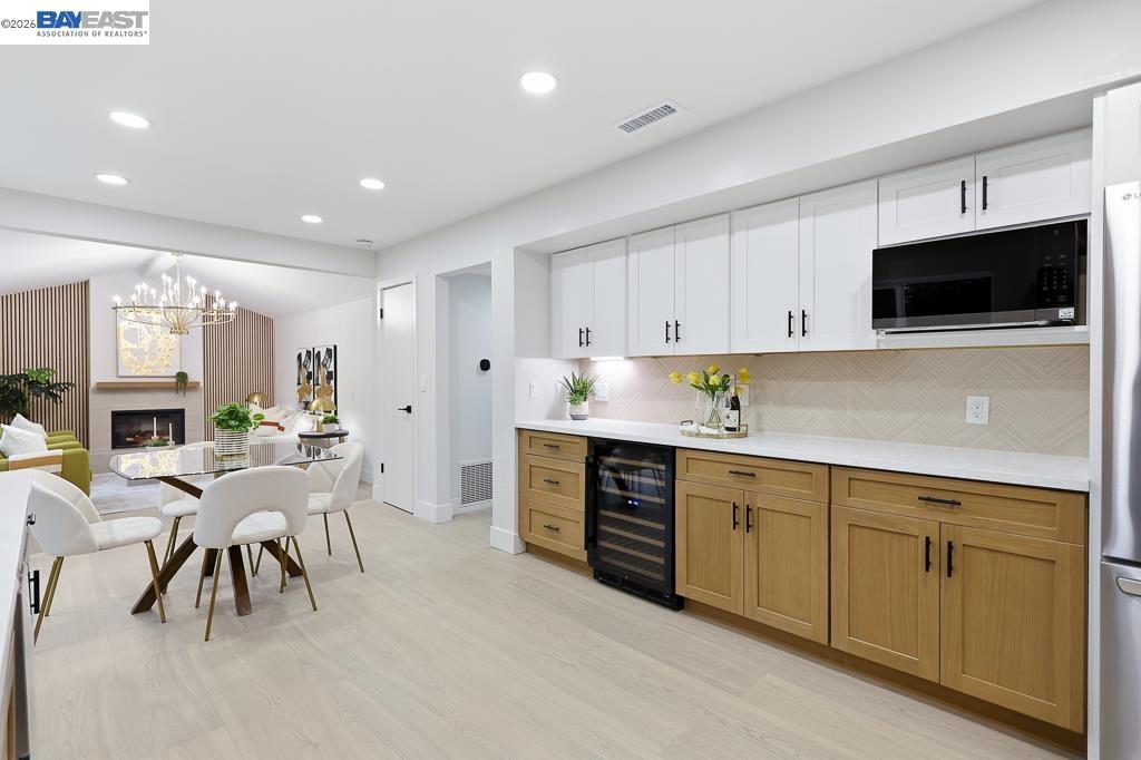 74 Hazelnut Court San Ramon, CA 94583 - Photo 21 of 60 a kitchen with white cabinets and stainless steel appliances