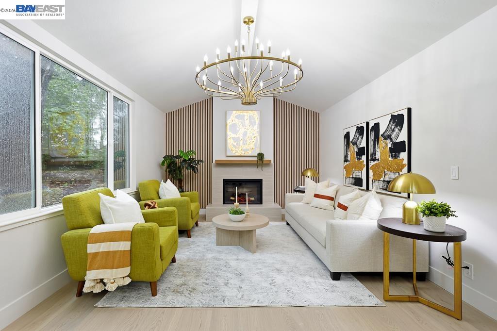 74 Hazelnut Court San Ramon, CA 94583 - Photo 25 of 60 a living room with furniture a fireplace and a chandelier