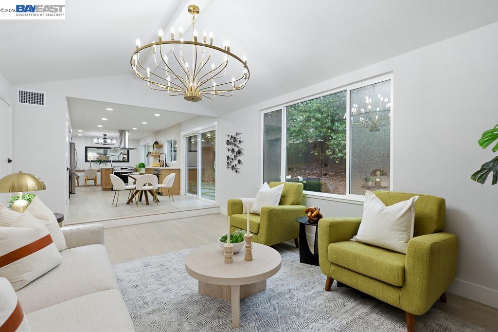 74 Hazelnut Court San Ramon, CA 94583 - Photo 26 of 60 a living room with furniture a table and a chandelier
