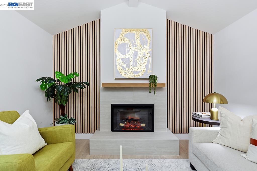 74 Hazelnut Court San Ramon, CA 94583 - Photo 27 of 60 a living room with furniture potted plant and a fireplace