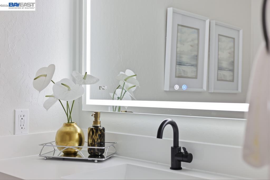 74 Hazelnut Court San Ramon, CA 94583 - Photo 29 of 60 a bathroom with a sink and a mirror