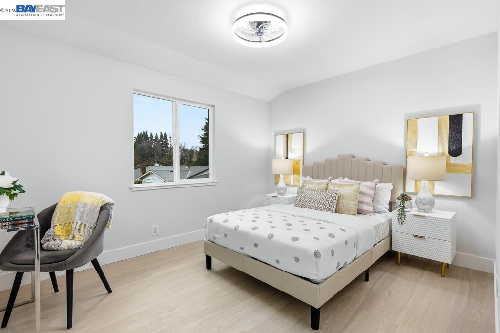 74 Hazelnut Court San Ramon, CA 94583 - Photo 35 of 60 a bedroom with a bed and a chair