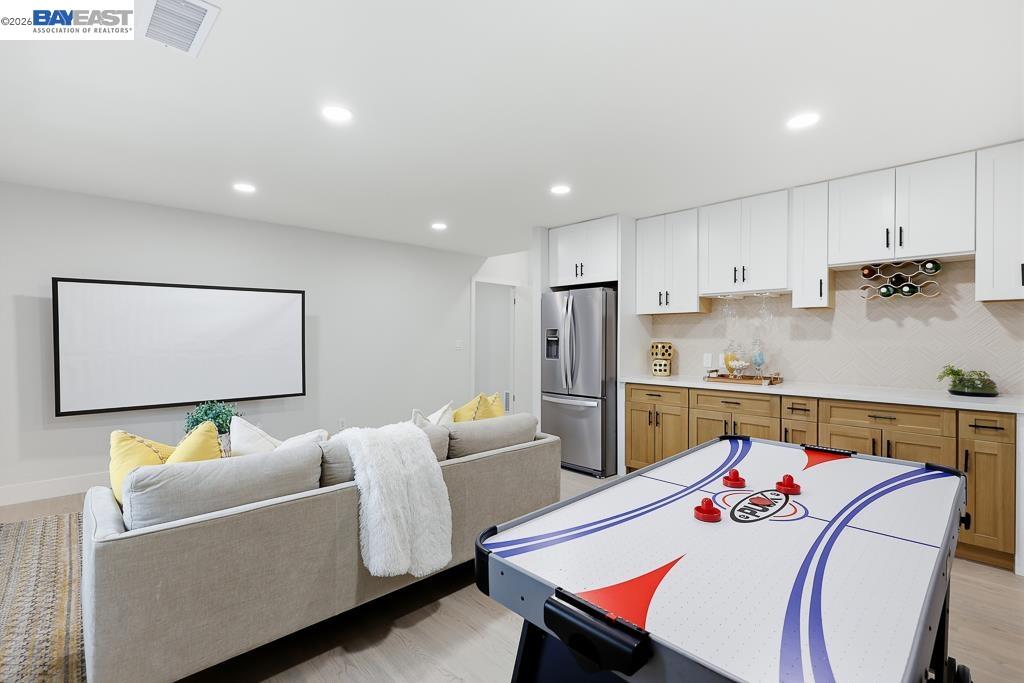 74 Hazelnut Court San Ramon, CA 94583 - Photo 45 of 60 a living room with stainless steel appliances furniture a rug and a table