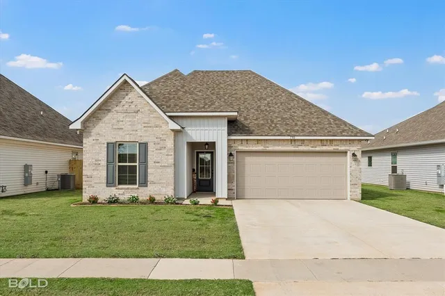 a view of a yard in front of a house with a yard