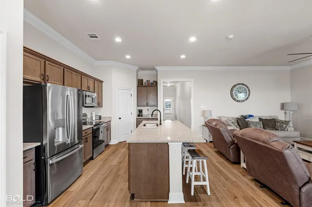 a view of a house with a yard and sitting area