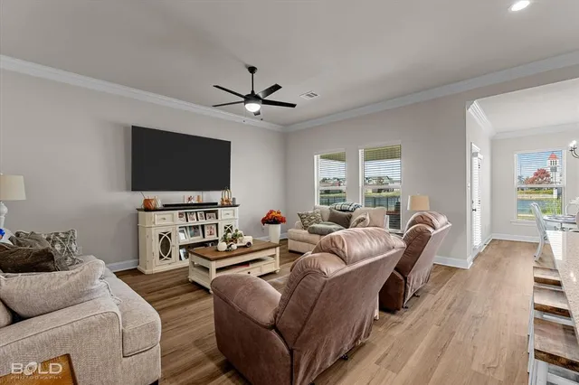 a dining room with furniture window and wooden floor