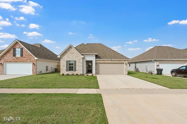 a front view of a house with a garage