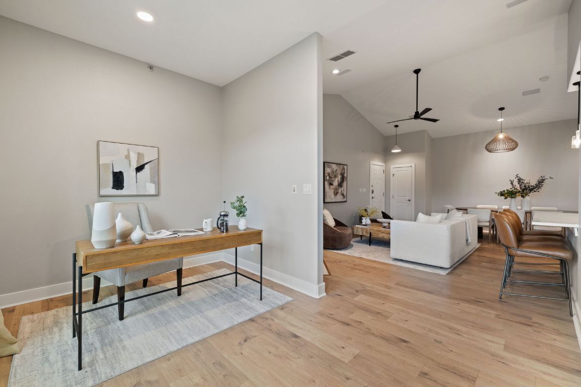 2216 Thornton Road, Unit 431 Austin, TX 78704 - Photo 11 of 30 a living room with furniture and a wooden floor