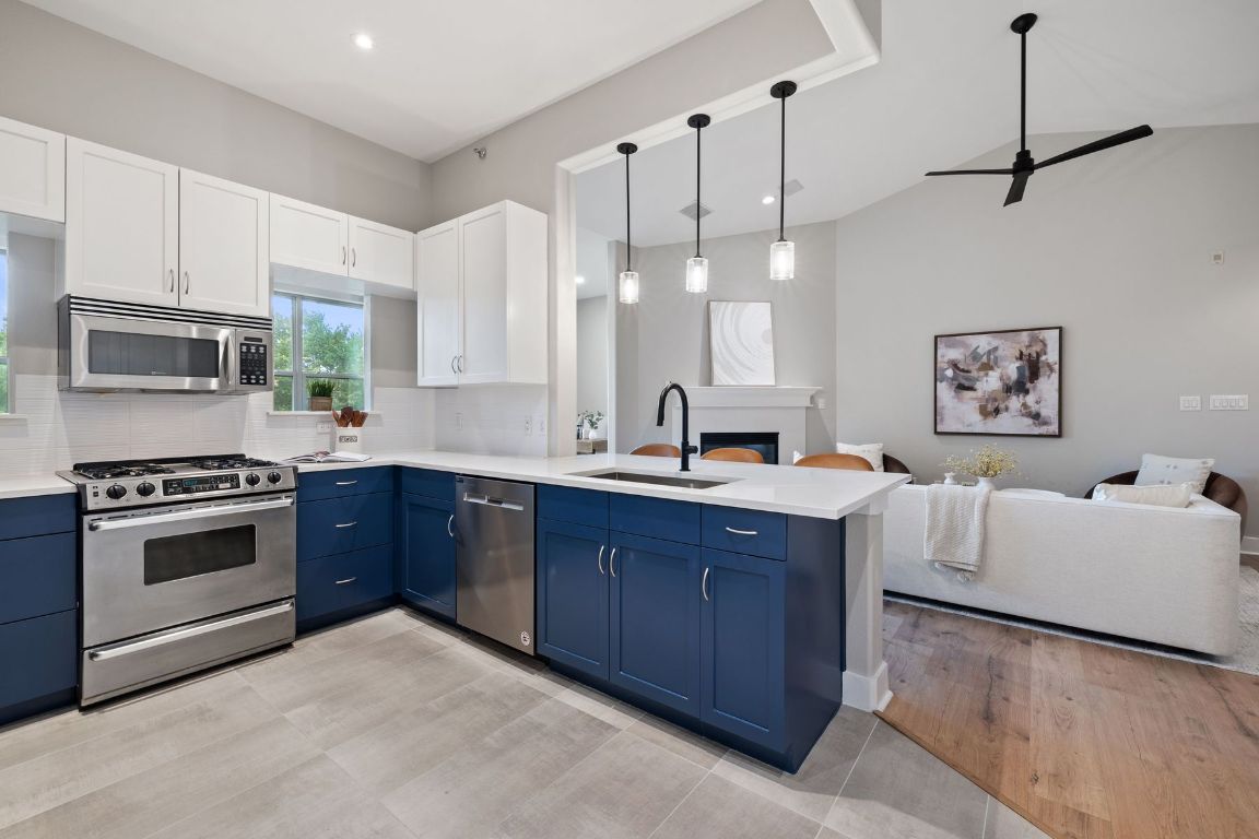 2216 Thornton Road, Unit 431 Austin, TX 78704 - Photo 15 of 30 a kitchen with stainless steel appliances granite countertop a sink and a stove