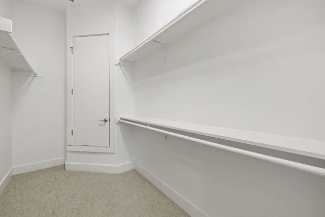 a view of an empty walk in closet