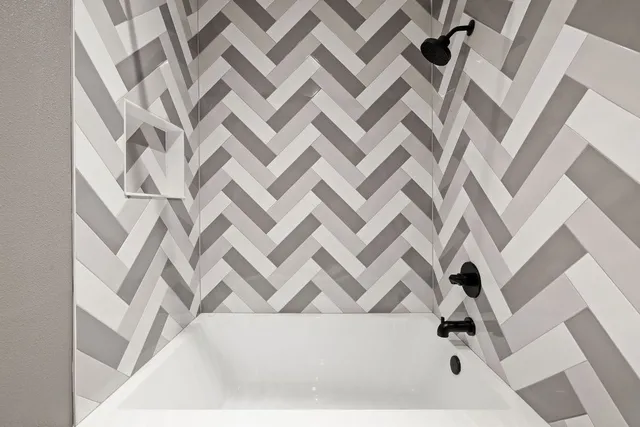 a view of washer and dryer with kitchen in the background