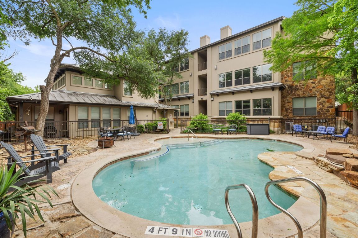 2216 Thornton Road, Unit 431 Austin, TX 78704 - Photo 26 of 30 a swimming pool with outdoor seating and yard