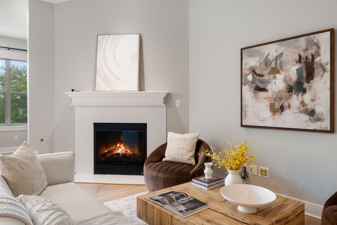 2216 Thornton Road, Unit 431 Austin, TX 78704 - Photo 3 of 30 a living room with furniture and a fireplace