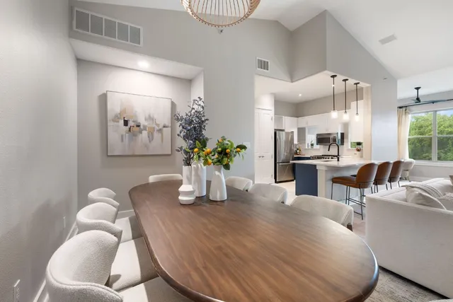 a dining room with furniture and wooden floor