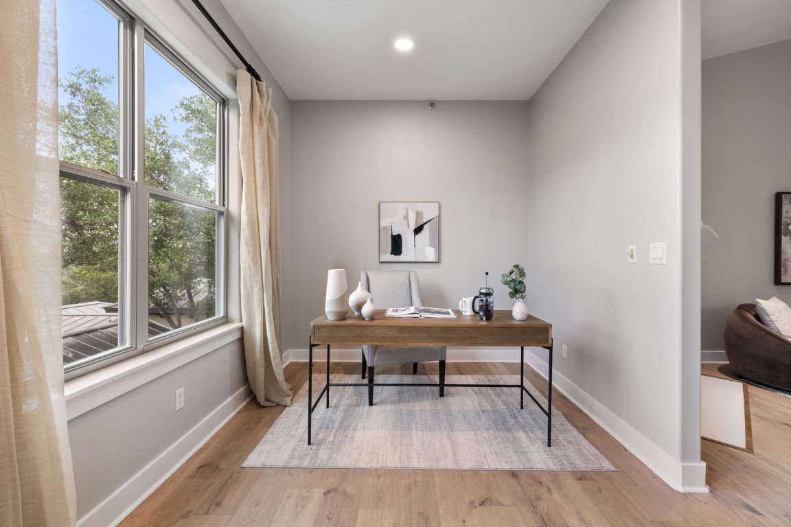 2216 Thornton Road, Unit 431 Austin, TX 78704 - Photo 10 of 30 a view of a workspace with furniture and a window